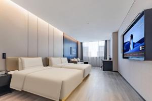 Μια τηλεόραση ή/και κέντρο ψυχαγωγίας στο Atour Hotel Jiuquan Drum Tower