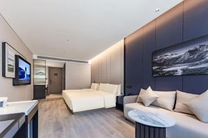 Μια τηλεόραση ή/και κέντρο ψυχαγωγίας στο Atour Hotel Jiuquan Drum Tower