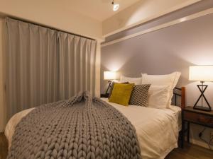 Postel nebo postele na pokoji v ubytování Aiwa Mansion / Vacation STAY 80391