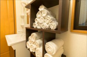 a bunch of rolled towels in a bathroom at Fukuoka - House / Vacation STAY 81254 in Fukuoka +10 photos