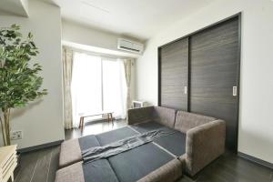 Ένα ή περισσότερα κρεβάτια σε δωμάτιο στο Suncourt Hongo Dori Garden Hills / Vacation STAY 7620