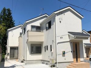 a white building with a lot of windows at Kinugawa Station Front room B in Nikko