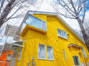 a yellow house with white windows on top of it at Nasu-gun - House - Vacation STAY 7648 in Nasu