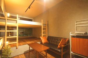 a living room with a couch and a bunk bed at Minamitsuru-gun - House - Vacation STAY 32256v in Azagawa