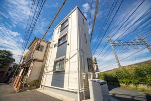 東京にあるSumida-ku - House - Vacation STAY 82129の通路脇の小さな白い建物