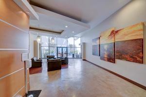 a living room with paintings on the wall at Amazing Condo Heart of San Diego in San Diego