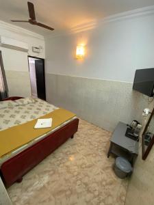 TV a/nebo společenská místnost v ubytování La Ruelle Guest House