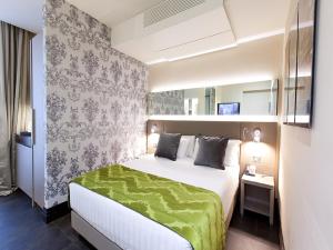 Posteľ alebo postele v izbe v ubytovaní Quirinale Luxury Rooms