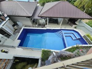 an overhead view of a swimming pool in a house at Eagles Nest Beach Resort Room 6 in Samal