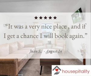 a living room with a couch and stars on the wall at Housepitality - The Southside Ranch in Columbus