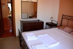 A bed or beds in a room at Asterida Villas