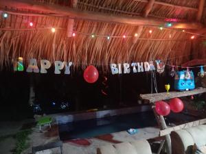 a party with a happy birthday banner and balloons at Casa Rústica Rancho de Lía- Vacacional in Orotina +88 photos
