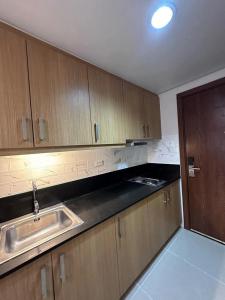 Η κουζίνα ή μικρή κουζίνα στο Staycation, Mall of Asia +2 φωτογραφίες