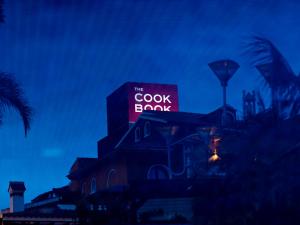 a building with a sign that reads the cook book at The Cookbook Gastro Boutique Hotel & SPA in Calpe