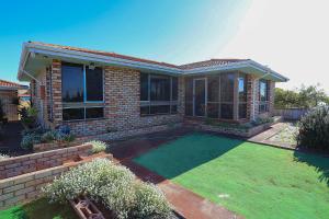 a house with a lawn in front of it at Smugglers Cove in Esperance
