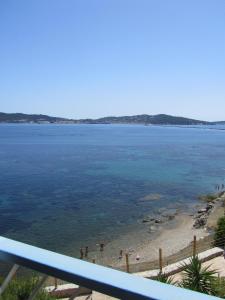 a view of a beach with people in the water at Appartement Le Cap in Toulon