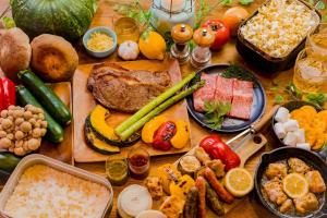 a table filled with different types of food on it at The Village Yufuin Onsen Glamping - Vacation STAY 17996v in Yufuin