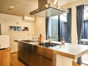 a kitchen with a sink and a stove at Rakuten STAY VILLA Awaji 102 3 bank beds, Capacity of 9 persons in Minamiawaji