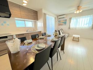 a kitchen and dining room with a table and chairs at Grande Ortho Okinawa Villa Onna 3 - Vacation STAY 83213 in Onna