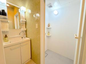a bathroom with a sink and a mirror at Grande Ortho Okinawa Villa Onna 3 - Vacation STAY 91370 in Onna +35 photos