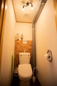 a bathroom with a toilet in a small room at Otaru Village - Vacation STAY 84438 in Otaru