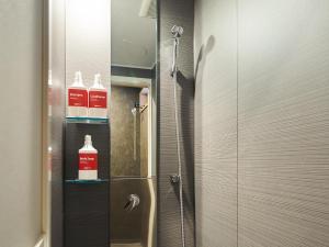 a bathroom with a shower with two bottles of cleaner at Rakuten STAY VILLA Lake Yamanakako 104 Pets allowed with dog run in Yamanakako +26 photos