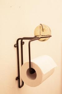 a toilet paper holder attached to a wall at Otaro Village - Vacation STAY 22334v in Otaru +13 photos
