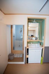 a bathroom with a sink and a shower at Otaru Village - Vacation STAY 84257 in Otaru