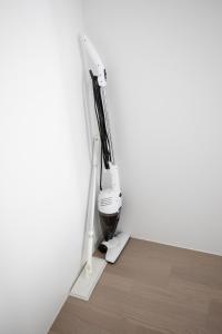 a hair dryer in a corner of a room at Tokyo WEST Laffite - Vacation STAY 8299 in Ogikubo