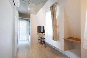 a small room with a desk and a television at Tokyo WEST Laffite - Vacation STAY 8298 in Ogikubo