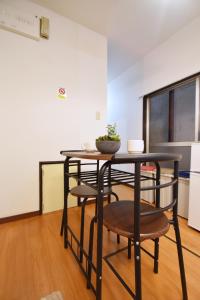 a dining room with a table and some chairs at Shinozaki Kodate - Vacation STAY 16392 in Tokyo