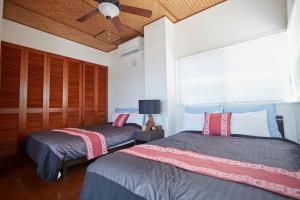 Ένα ή περισσότερα κρεβάτια σε δωμάτιο στο MAEDA OCEAN FRONT - Vacation STAY 84477 +2 φωτογραφίες