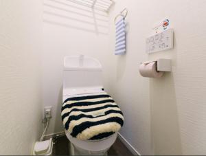 a bathroom with a black and white striped toilet seat at Room 301 - Vacation STAY 86501 in Fukuoka