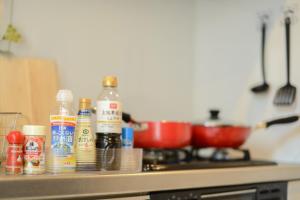 a kitchen counter with spices and condiments on it at Room 301 - Vacation STAY 86506 in Fukuoka +6 photos