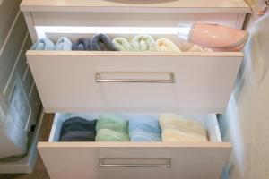 a drawer of a refrigerator filled with towels at Room 301 - Vacation STAY 86506 in Fukuoka