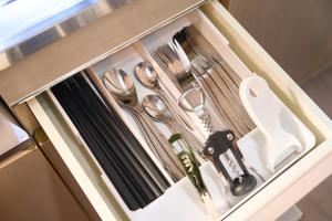 a drawer with silver utensils in a kitchen at SHAKUNAGE-BEKKAN - Vacation STAY 85762 in Yufuin +30 photos