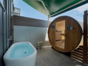 a bathroom with a toilet and a bath tub at Rakuten STAY HOUSE Amakusa 103 in Kami Amakusa +34 photos