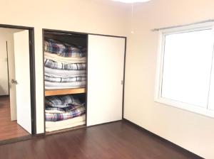 a room with a closet filled with shirts at Ark City Asahikawa - Vacation STAY 8528 in Asahikawa
