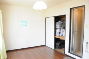 a room with a mirror and a closet at Ark City Asahikawa - Vacation STAY 8530 in Asahikawa