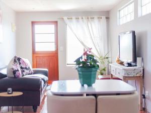 a living room with a couch and a table at Julinas Self Catering Apartments in Parow