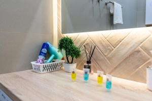 a bathroom counter with a sink and a mirror at Светлая квартира-студия в 5-минутах от Мега Парк in Almaty
