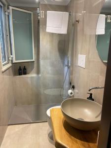a bathroom with a sink and a shower at M&J house in Reggio Calabria