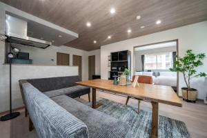 a living room with a couch and a table at Mks 201 in Asahikawa +98 photos