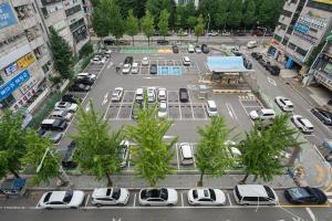 an aerial view of a parking lot with cars parked at No25 Hotel Songnae Station in Bucheon