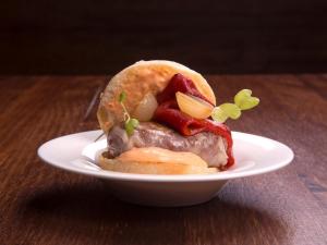 a sandwich on a plate on a table at The Cookbook Gastro Boutique Hotel & SPA in Calpe