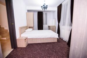 Llit o llits en una habitació de Vila Naty