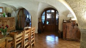 a living room with a table and a dining room at chez Annie & Marcel in Le Monêtier-les-Bains