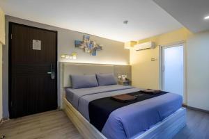 Ένα ή περισσότερα κρεβάτια σε δωμάτιο στο Infiniti Hotel +146 φωτογραφίες