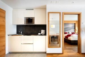 Postel nebo postele na pokoji v ubytování Apartment Crown Andermatt-5