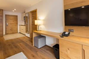 Kuchyň nebo kuchyňský kout v ubytování Apartment Crown Andermatt-5